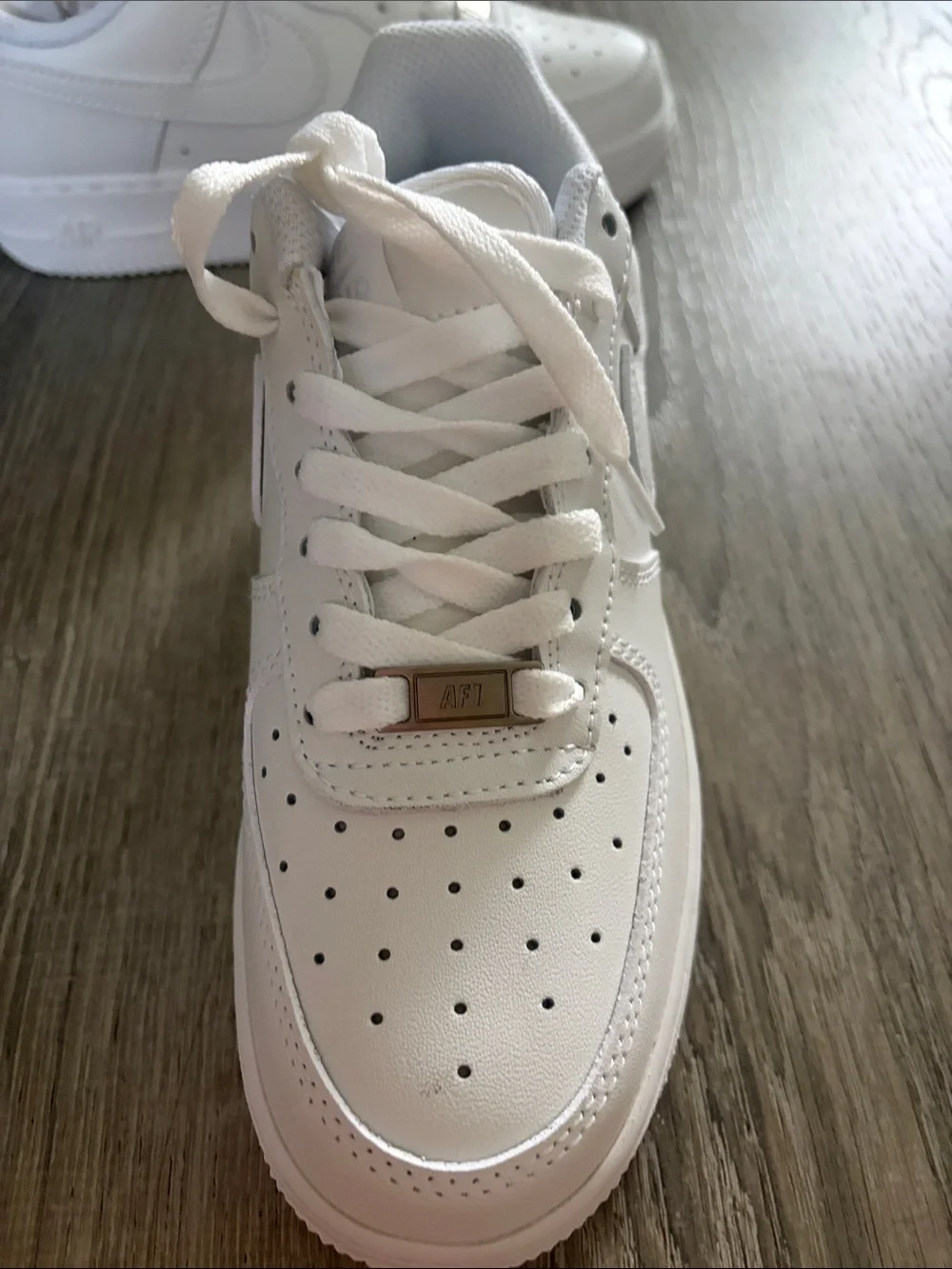 Air Force 1’s Men’s White Low-Top Sneakers